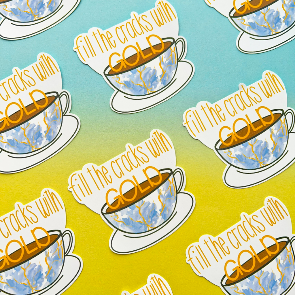Stickers all with the same design are spaced evenly in diagonal rows going across the image. A porcelain cup and saucer. The cup has cracks filled with gold ink. Above is the text 'fill the cracks with gold'. The image has a blue to yellow hombre effect background.