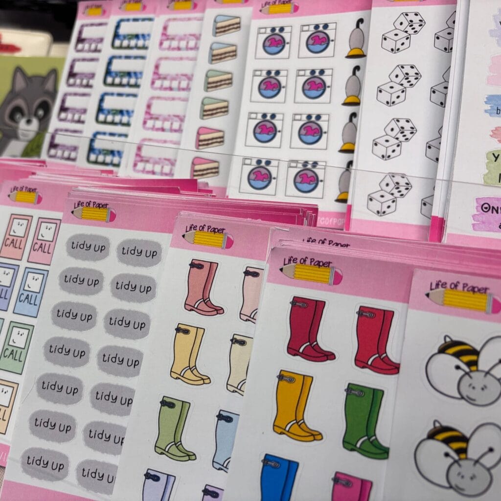 Tiered shelves with assorted sticker sheets stood in it.